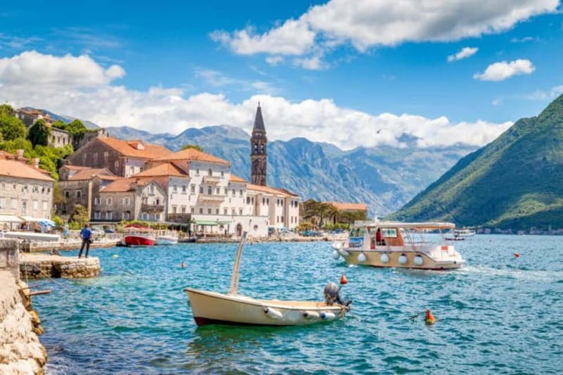 From Dubrovnik: Montenegro Boat Tour from Perast to Kotor - Boarding the boat in Kotor Bay: fortress views from the water